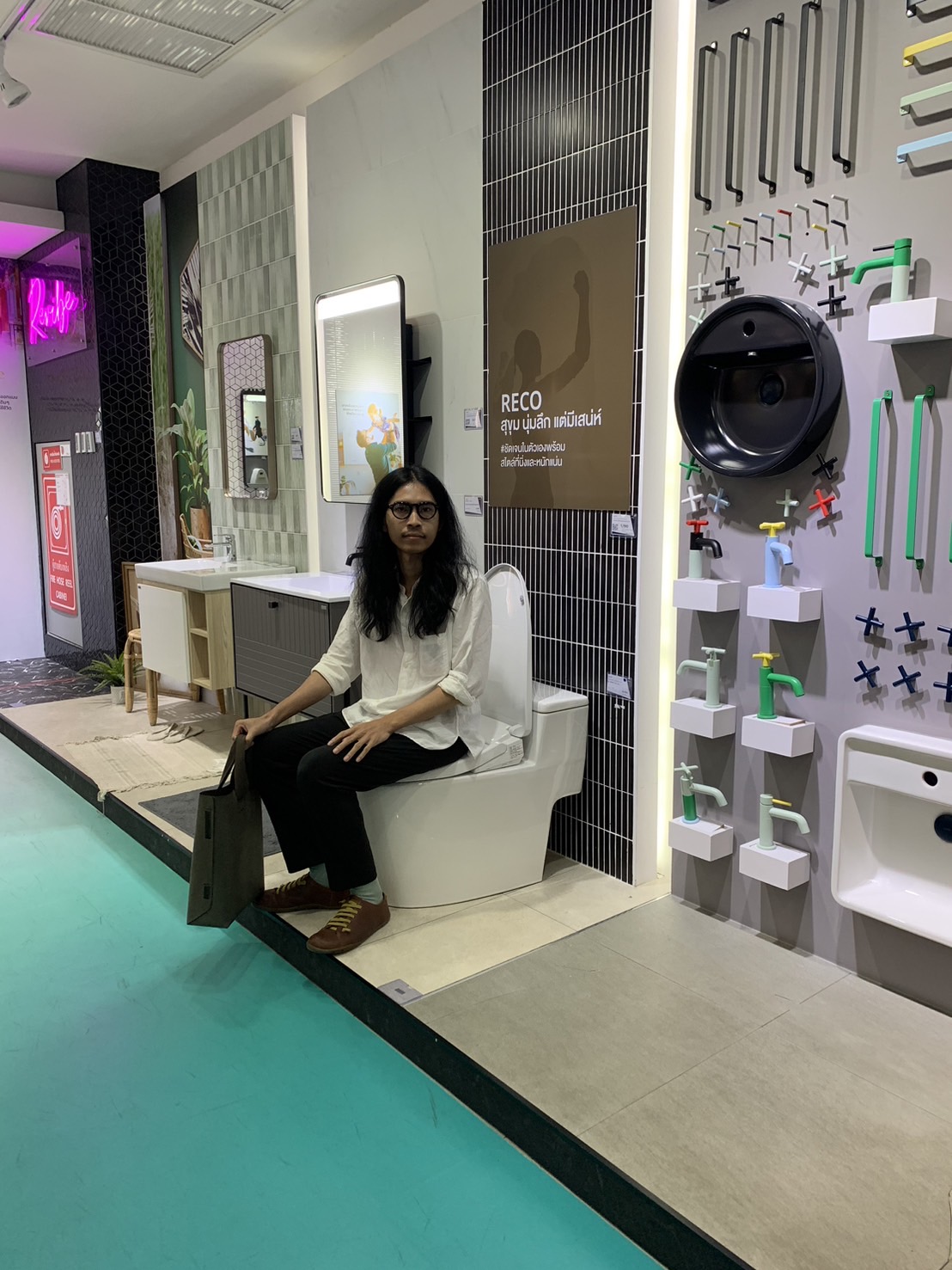 man sitting on an installation toilet